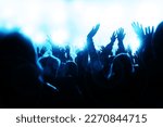 Small photo of Electrifying energy of a music concert as young, sheering people revel in the beats and rhythms. With hands waving in the air, the crowd radiates pure joy and enthusiasm; party vibes