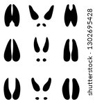 black footprints of deer on a... | Shutterstock .eps vector #1302695428