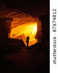 Small photo of Silhouette of photographer taking photo in a cave (King Solomon Quarries a.k.a. Zedekiah's Cave in Jerusalem, Israel)