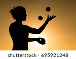 silhouette of a woman juggling... | Shutterstock . vector #695921248