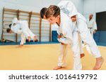 Small photo of Kid judo, young fighters on training, self-defense