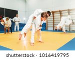 Small photo of Kid judo, young fighters on training, self-defense