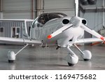 Small photo of Small private turbo-propeller airplane in hangar