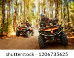 Two Atv Riders  Speed Race In...