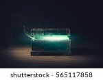 Small photo of open pandora's box with green smoke on a wooden background /high contrast image