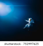 Astronaut Floating In Outer...