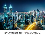 Fantastic view of a big city at night with illuminated modern architecture. Dubai downtown, United Arab Emirates.