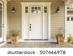 White front door with small...