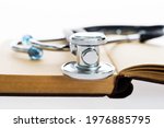Stethoscope On A Book Isolated...