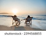Small photo of Couple sunbathing on a beach chair.