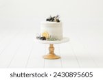 natural white cake with lemon blueberry garnish