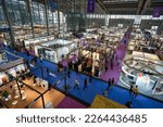 Small photo of SHENZHEN, CHINA - 27 NOVEMBER, 2019: top view of exhibition stands and people at Fashion Source space in Shenzhen Convention Exhibition Center.