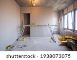 Working process of installing metal frames for plasterboard -drywall - for making gypsum walls in apartment is under construction, remodeling, renovation, extension, restoration and reconstruction.