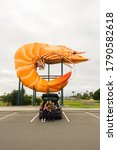 Small photo of Ballina, Australia - July 2020: Big Prawn, one of the iconic "giant things" dotted around Australia. The prawn had a makeover in 2013 to add the tail