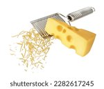 Piece of cheese is rubbed on a hand grater