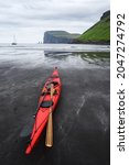 red kayaks on the beach in... | Shutterstock . vector #2047274792