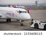 Small photo of Almaty, Kazakhstan - 03.16.2022 : The plane of the Mongolian airline Hunnu Air is parked at the airport site.