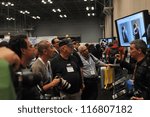 Small photo of NEW YORK - OCTOBER 26: People attending the PDN PhotoPlus Expo is the largest photography show in North America, was held at the Jacob K Javits Convention Center on October 26, 2012 in New York City