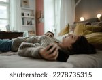 Young teenage girl with smartphone in the room.
