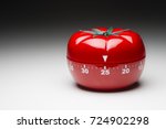 Tomato-shaped kitchen timer set at 25 minutes 