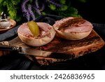 Small photo of Tasty sandwich with brawn and pickled cucumber. Dark light. Shallow depth of field.