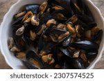 Small photo of mussel soup in a ceramic tureen