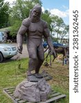Small photo of Milaca, Minnesota, United States July 29, 2022 Statue of Bigfoot at an antique store in Milaca, Minnesota, USA.