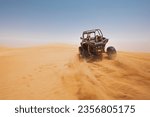 Small photo of sand dune bashing offroad. utv rally buggy
