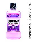 Small photo of SWINDON, UK - APRIL 13, 2021: A bottle of Listerine Total Care Milder Taste Smoth Mint mouth wash with zero alcohol on an isolated white background