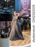 Small photo of New York, NY, USA - October 25th, 2019: Model poses for photographers at PDN PhotoPlus 2019 conference and expo at Javits Convention Center, Manhattan