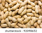 Peanuts in their shell textured food background.