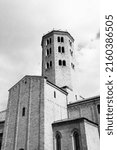 Small photo of Church of Saint Antonino in Piacenza, Italy. The saint is Piacenza's patron. Italian town. Black and white vintage style photo.