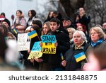 Small photo of Kuldiga, Latvia - March 2, 2022: Hundreds of people holding banners and flags participated at a "Stand With Ukraine" rally, against war and Russian aggression. Ukraine solidarity support in Latvia.