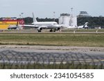 Small photo of Riga, Latvia - July 3, 2023: Avion Express Airbus A320-232 9H-AMI in RIX International Airport.