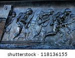 A panel from the National World War II Memorial in Washington, D.C. depicting an amphibious landing in the Pacific theater