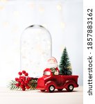 santa claus in a red car with a ... | Shutterstock . vector #1857883162