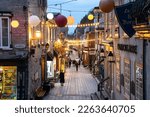 Small photo of Quebec City, Canada - November 7, 2022: View of historic lower Quebec City in Canada seen at night with people and lights