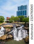 Small photo of Greenville, South Carolina USA - May 4, 2022: Downtown cityscape view of the popular Falls Park on the Reedy in this charming southern town.