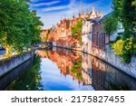 Small photo of Bruges, Belgium. Panoramic view of the historic city center of Brugge with Groenerei Canal in beautiful golden morning light at sunrise, province of West Flanders.