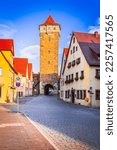 Small photo of Rothenburg ob der Tauber, Germany. Roeder Gate in Rothenburg downtown, Franconia medieval Bavaria. Romantic Road famous scenic route.