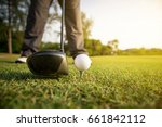 golfer prepare drive golf ball from tee off. copy space on Right side.