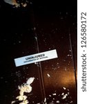 Small photo of LITTLE FALLS, NJ - JAN 30: A label with the words 'Uninjured' is shown in a NJ Transit train to NY on January 30, 2013 in Little Falls, NJ. The train collided with a truck carrying paint material.
