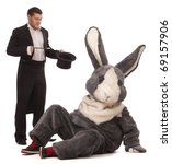 Small photo of Luckless magician conjuring with a inconceivable rabbit over white background