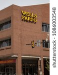 Small photo of Lancaster, PA, USA - May 5, 2018: Exterior sign of Wells Fargo bank at one of its 8300 branch offices.