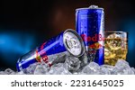 Small photo of POZNAN, POL - NOV 25, 2022: Cans of Red Bull, an energy drink sold by Red Bull GmbH, an Austrian company created in 1987