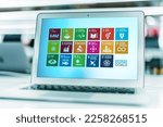 Small photo of POZNAN, POL - NOV 20, 2021: Laptop displaying logo of The Sustainable Development Goals, a collection of 17 interlinked global goals set up in 2015 by the United Nations General Assembly
