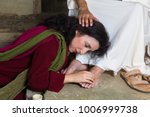Mary Magdalene crying of shame and embalming Jesus