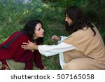 Small photo of Repentant sinner woman touching the robe of Jesus, asking for forgiveness and healing