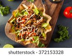 Taco Salad in a Tortilla Bowl with Beef Cheese and Lettuce