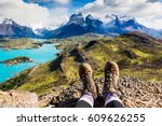 Girl hiking boots having fun and enjoying wonderful breathtaking mountain view. Freedom concept. Los Cuernos rocks, Patagonia, Chile